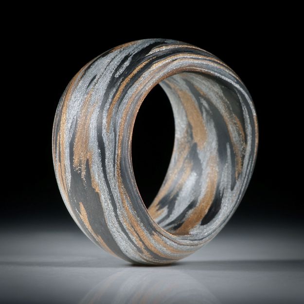 Karbonring Fibertec, mit Glasfaser Bronze und Alu, geschwungene Form mit bombierter Aussenseite