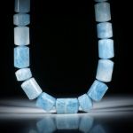 Edelsteincollier Aquamarin, polierte Zylinderformen mit bombierten Seiten, Durchmesser ca.15-17mm, Länge ca.45cm
